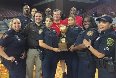 Cruz poses with Officers that provided security during the game; (Photo: Chris Daigle)